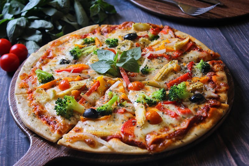 Veggie supreme pizza with colorful toppings